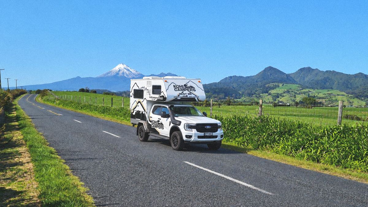 Kohi 4x4 Camper on a country road with Mount Taranaki behind