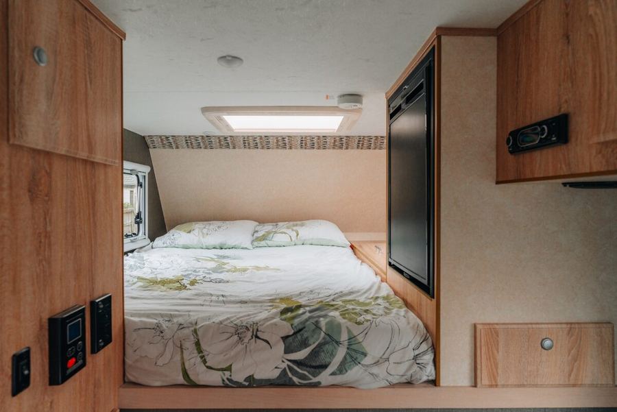 Cabover double bed with fridge and window